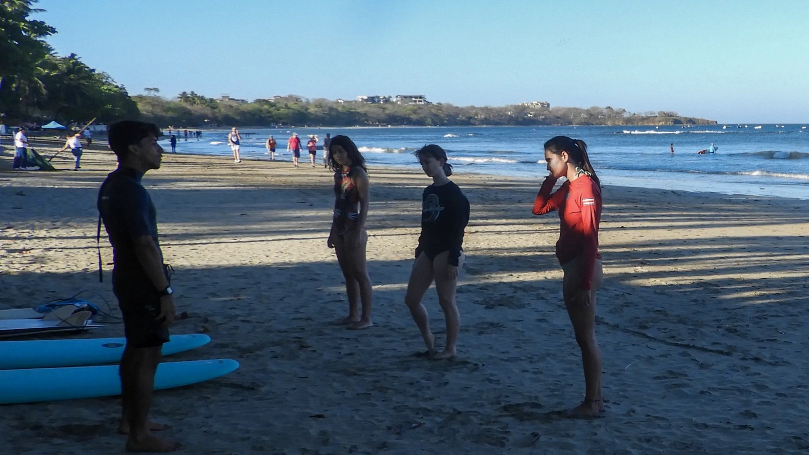 Beginner surf lesson on a sand-bottom beach in Tamarindo